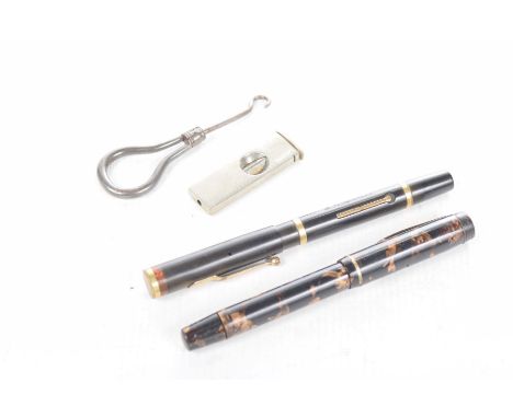 A Swan self filler fountain penA Mentmore auto pen, folding button hook and a cigar cutter