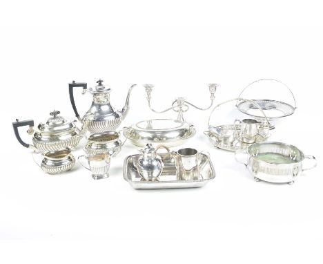 A collection of EPNS wareTo include a three piece tea service, coffee pot, milk jug, entree dish and cover, three branch cand