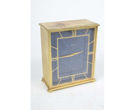 A Jaeger le Coultre mantel clock With a gilt metal case and gilt metal Roman numerals mounted to a perspexfront with tapered 