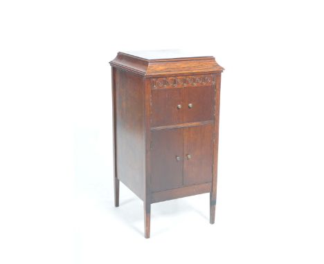 An early 20th Century Apollo gramophone music cabinet With a hinged caddy top enclosing a turn table, Apollo No: 113 above a 