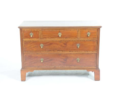 An early 20th Century mahogany chest by Warring'sWith a rectangular moulded top above three short and two long drawers each w