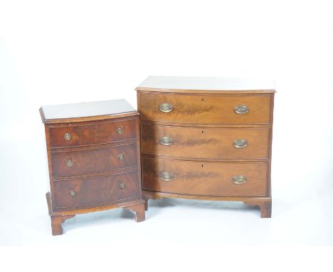 A 19th Century style mahogany bowfront chest and Reprodux bowfront chestWith a bowfront moulded top above three cockbeaded dr
