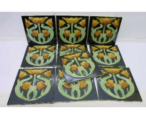 Ten Art Nouveau style floral decorated tiles