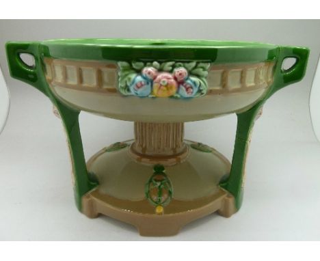 An Art Nouveau Eichwald green glaze pottery bowl, 7766 mark on base, a/f, height 15cm