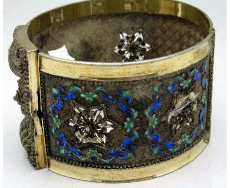 A white metal and enamel bangle, a/f