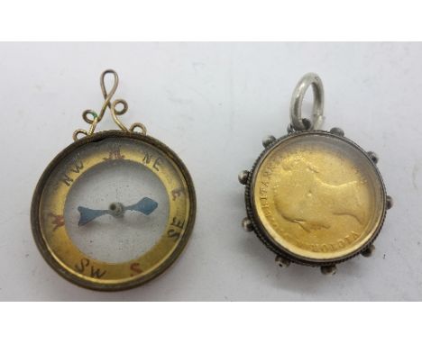 A 9ct gold mounted compass and a silver mounted coin