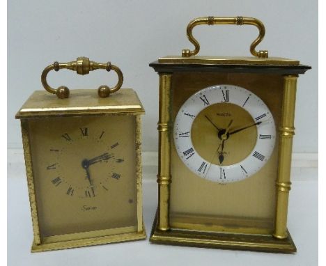 A Swiza 8-day alarm clock, a/f, and a Swiza quartz alarm clock