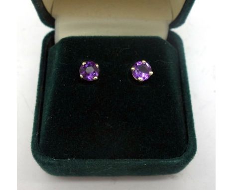 A pair of 9ct gold and amethyst stud earrings