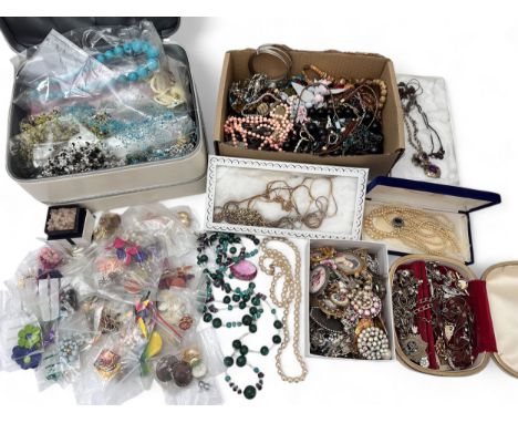 A quantity of costume jewellery. Includes a malachite bead necklace, a collection of vintage brooches, gold plated chains,  n