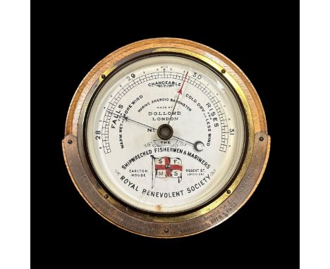 Dolland London Marine Aneroid Barometer. Mid-twentieth century, oak cased with white ceramic dial. Barometer Presented To T. 