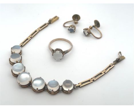 A moonstone bracelet, ring and earrings set. A bracelet, likely early 20th Century, with seven round graduated cabochon moons