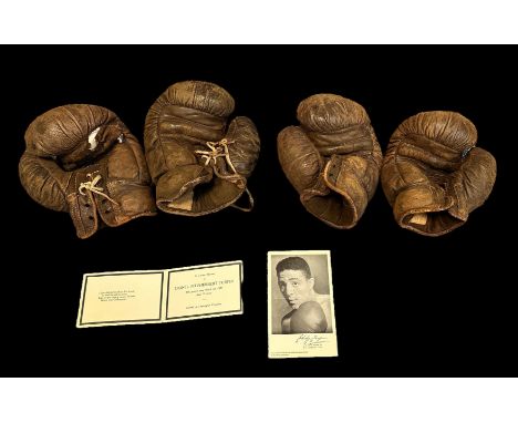 Two pairs of vintage boxing gloves with a Randy Turpin's printed autograph. Also includes a card from Lionel Turpin’s funeral