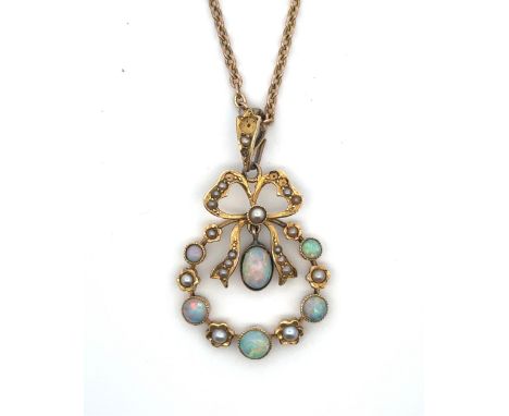 An art nouveau opal pendant with bow crest stamped 15ct on a 16" yellow metal chain (tests as 9ct using XRF). Weight 6.16g. P