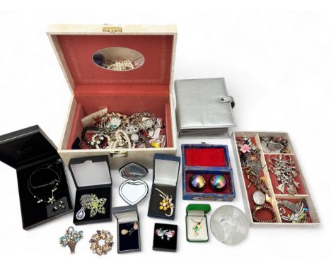 A jewellery box containing silver and costume jewellery including a silver charm bracelet. Also a pair of vintage Chinese med