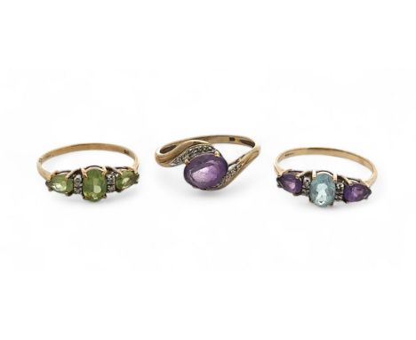 Three 9ct gold and gem set rings. A peridot and diamond ring size U,  an amethyst and diamond ring size V, and a topaz and am
