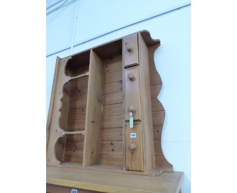 A PINE ENCLOSED DRESSER BACK, THE ARCADED TOP SHELF ABOVE ANOTHER SHELF AND THREE DRAWERS