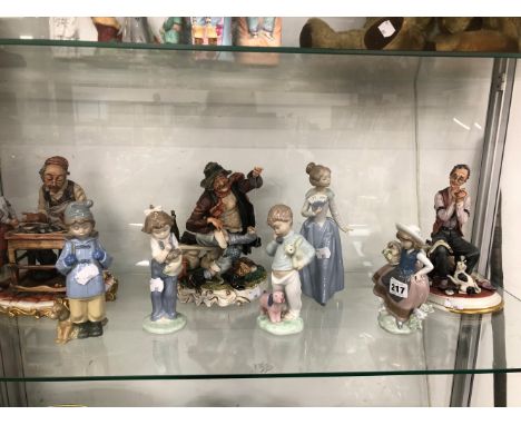 A LLADRO FIGURINE, FOUR NAO FIGURINES AND THREE CAPODIMONTE FIGURINES. 