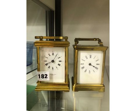A TAYLOR AND BLIGH BRASS CASED CARRIAGE CLOCK, TOGETHER WITH AN UNSIGNED CARRIAGE CLOCK. 