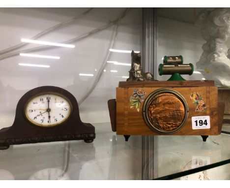 A VINTAGE MUSICAL CIGARETTE DISPENSER, A SMALL MANTEL CLOCK. 