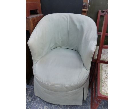 A VICTORIAN TUB ARMCHAIR, THE TURNED EBONISED LEGS ON BROWN CERAMIC CASTER FEET