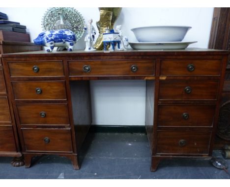 A 20th C. MAHOGANY PEDESTAL DESK, THE KNEEHOLE DRAWER FLANKED BY BANKS OF FOUR DRAWERS ON BRACKET FEET BELOW THE LEATHER INSE