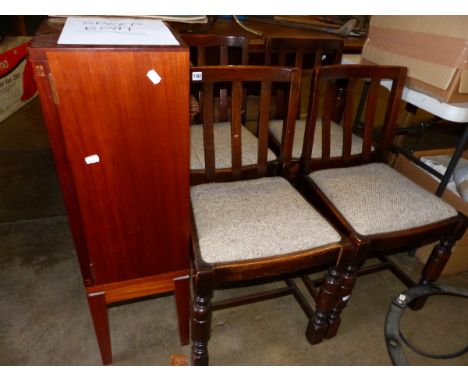 A SMALL RETRO BOOKCASE AND FOUR OAK DINING CHAIRS AND A LARGE WICKER HAMPER. 