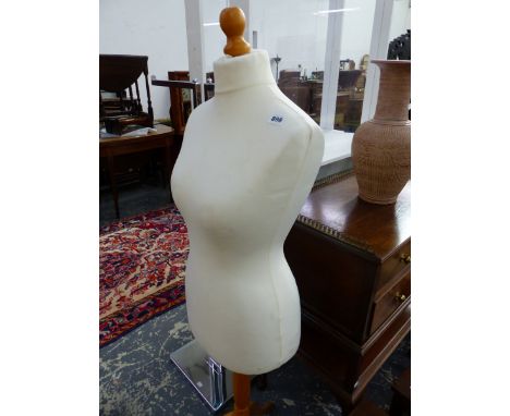 A LADYS MANNEQUIN RAISED ON A PINE TRIPOD.   H 146cms.