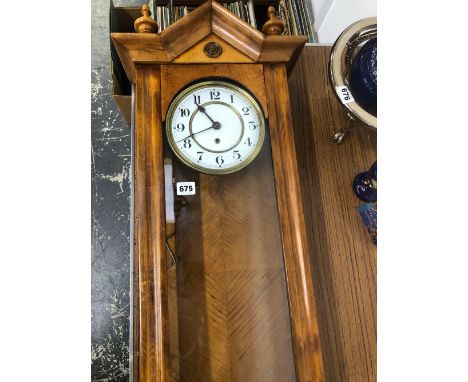 AN ANTIQUE WALL CLOCK. 