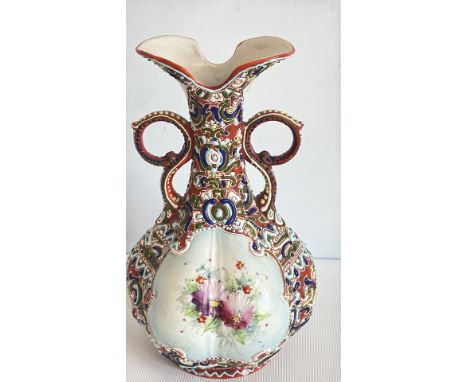 Ornate ceramic vase with floral design, intricate polychrome patterns, and two handles. Marked with number 1601 and Persian s