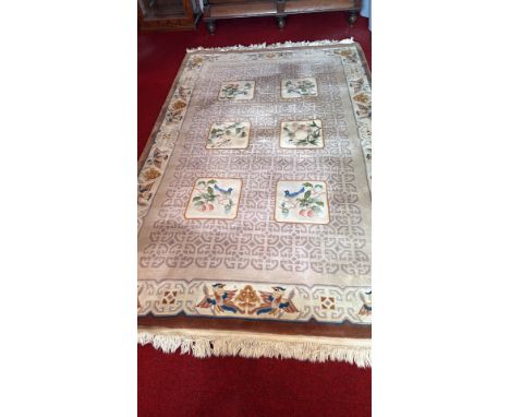 Antique Persian carpet with floral and bird motifs, fringed edges, traditional design.