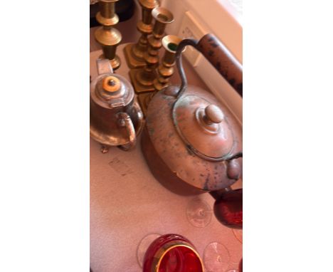 Mixed lot including copper kettle, brass candlesticks, silver-plated teapot, and red glassware.