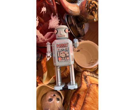 Porcelain figurine of a girl with rabbits, detailed base with tree trunk. Mixed lot includes silver teapot, ceramic cat, and 