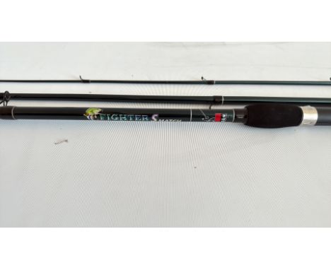 Fighter S Match fishing rod, black with green and blue graphics, foam handle, and reel seat. Brand: DAM.