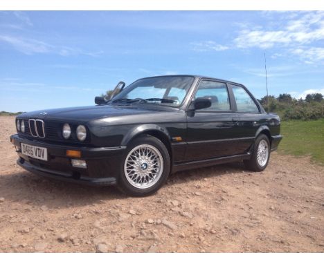 A 1987 BMW 3 Series E30 M-Tech 1, registration number D465 VDV, black. This was a very capable car, having a 2.5 litre straig