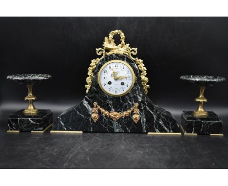 H. Perrin - A 19th century French garniture marble mantel clock and tazza form side pieces, titled '1er Prix Paris'. White en