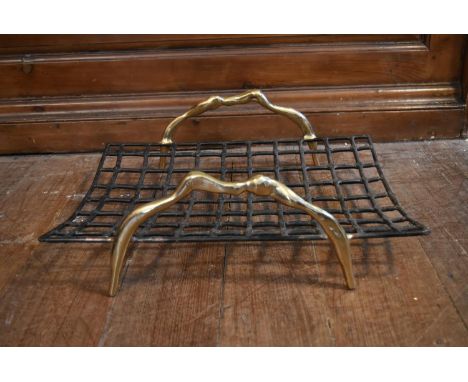 A contemporary wrought iron log basket with brass handles, designed by David Marshall. H.18 W.55 D.39cm 