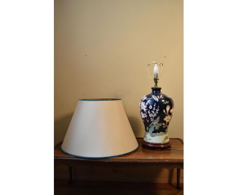 A contemporary baluster form table lamp with floral decoration and cream shade. H.60 W.22cm. (height base only). 