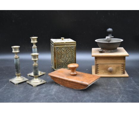 A collection of vintage collectable items. To include a coffee grinder, a blotter, three candleholders and an Indian brass li