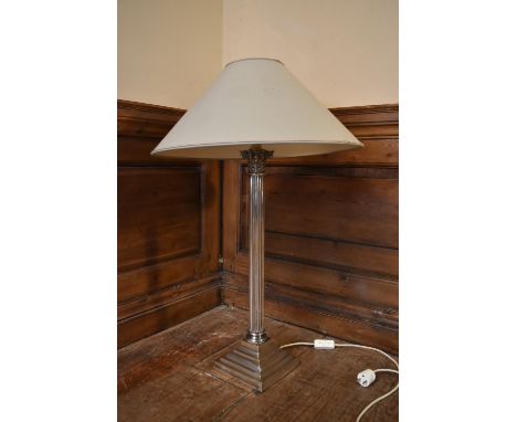 A 20th century silver plated Corinthian column style table lamp with sage green shade. H.69 W.18cm (with shade H.84cm)