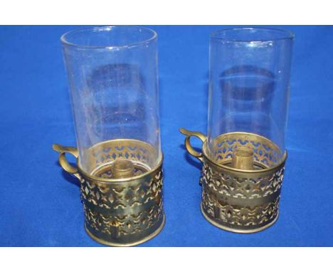 LOT OF BRASS ITEMS
including an ormolu-style sconce arm, a candlestick, two chambersticks with glass flumes, two oil lamp bur