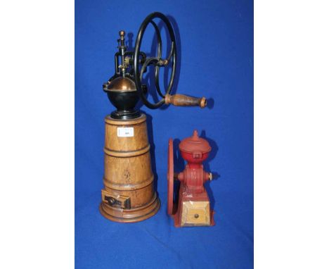 TWO VINTAGE COFFEE GRINDERS
one with black painted metal work and winding wheel, with wooden hold; together with a smaller re