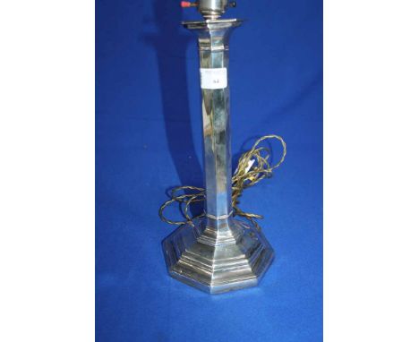 LARGE SILVER CANDLESTICK LAMP
of octagonal column form, converted to electricity, 37cm high