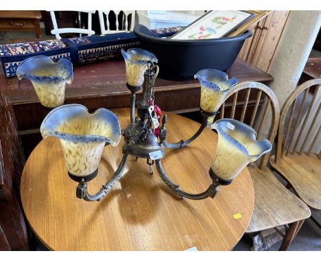 A five branch ceiling light with blue and yellow mottled glass shades