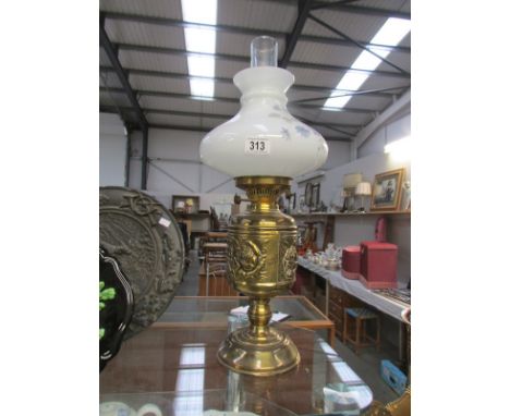 A brass oil lamp.