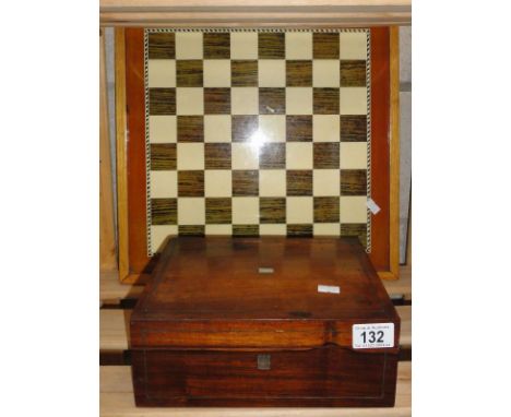A chess board and wooden box and contents.