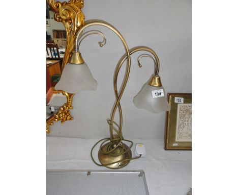 A two branch table lamp.