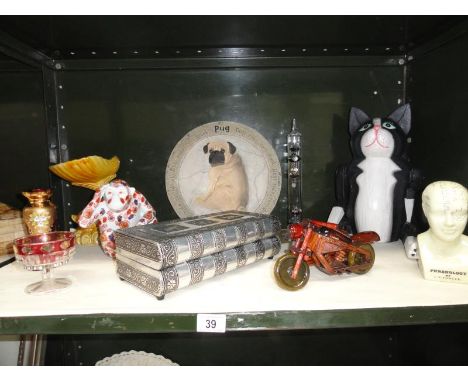 A shelf of assorted items including Fowler Phrenology bust, trinket box in the form of a pair of books, animal figures etc. 