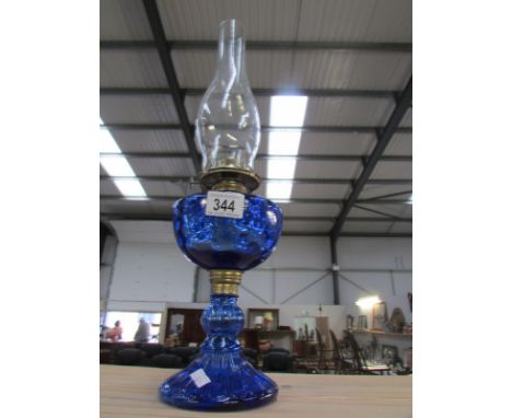A blue glass oil lamp.