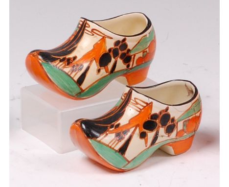 A pair of 1930s Clarice Cliff Orange Trees and House pattern pottery clogs, each typically painted in bright colours, black p