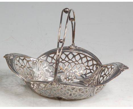 An Art Nouveau silver pierced bonbon dish, having swing handle, of shaped form with embossed floral detail, makers mark for W